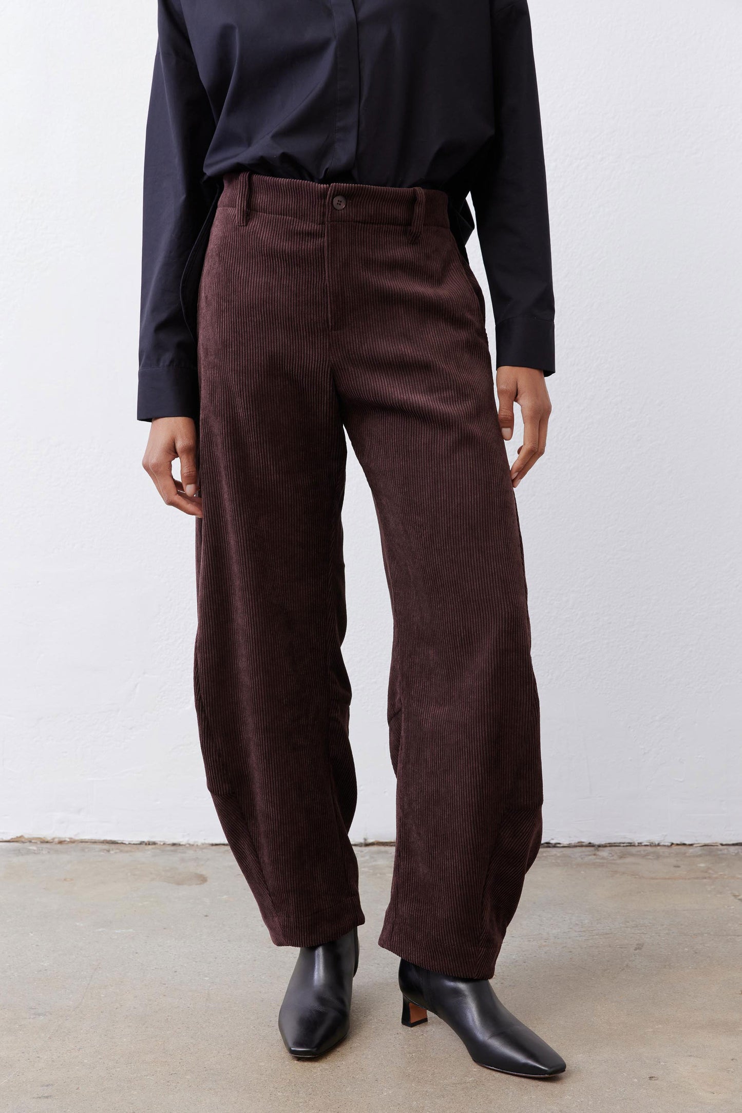 Chocolate-plum corduroy barrel pants detail, relaxed straight leg and front seam