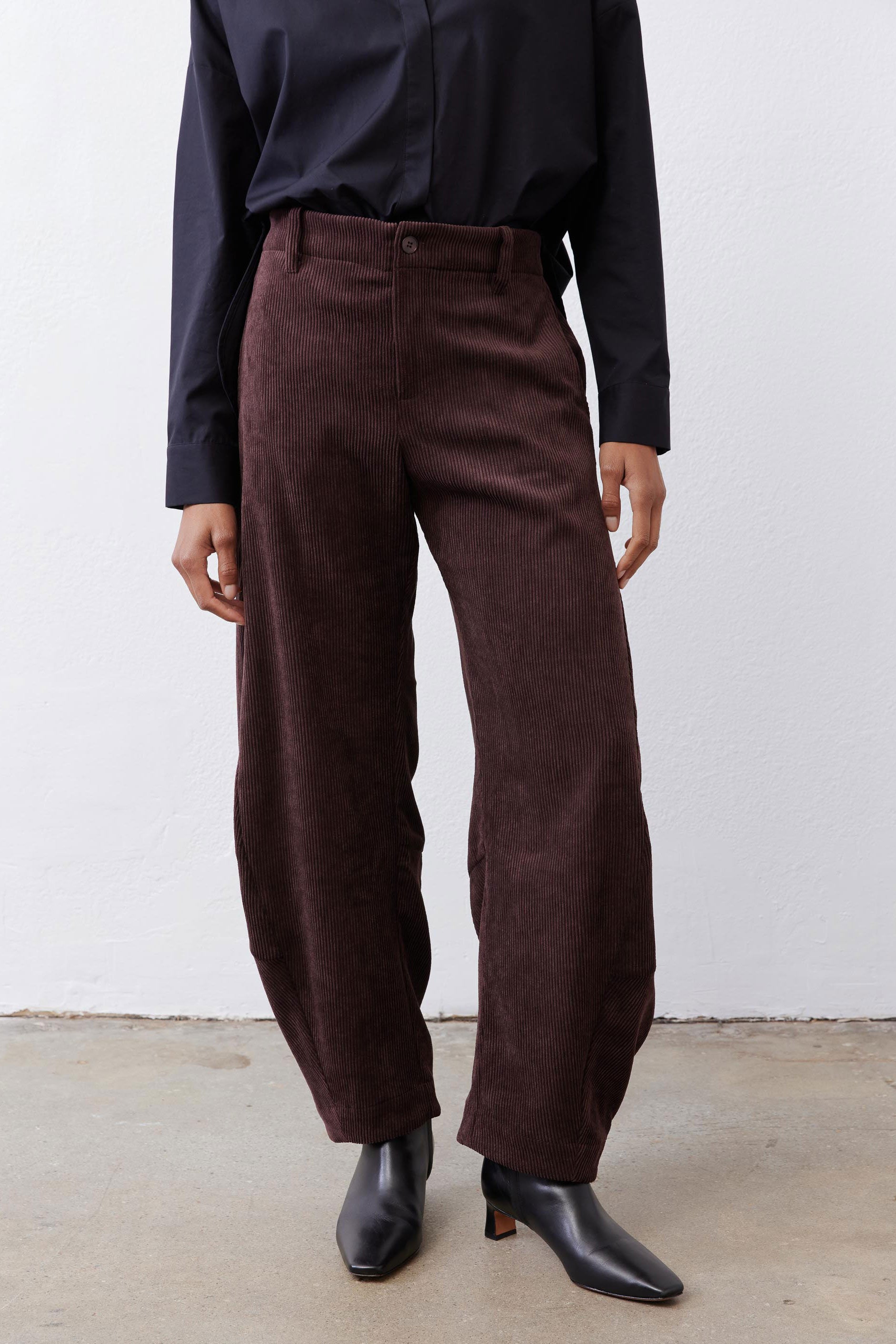 Chocolate-plum corduroy barrel pants detail, relaxed straight leg and front seam