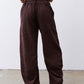 Chocolate-plum corduroy barrel pants detail, elastic waistband and tapered ankle opening