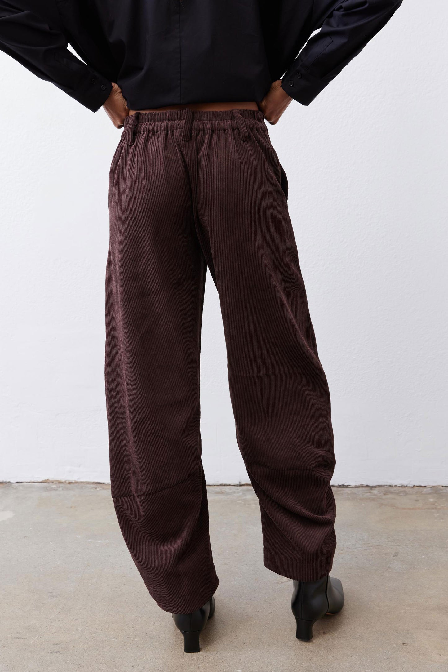 Chocolate-plum corduroy barrel pants detail, elastic waistband and tapered ankle opening