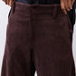 Chocolate-plum corduroy barrel pants close-up, button fly and welt pockets