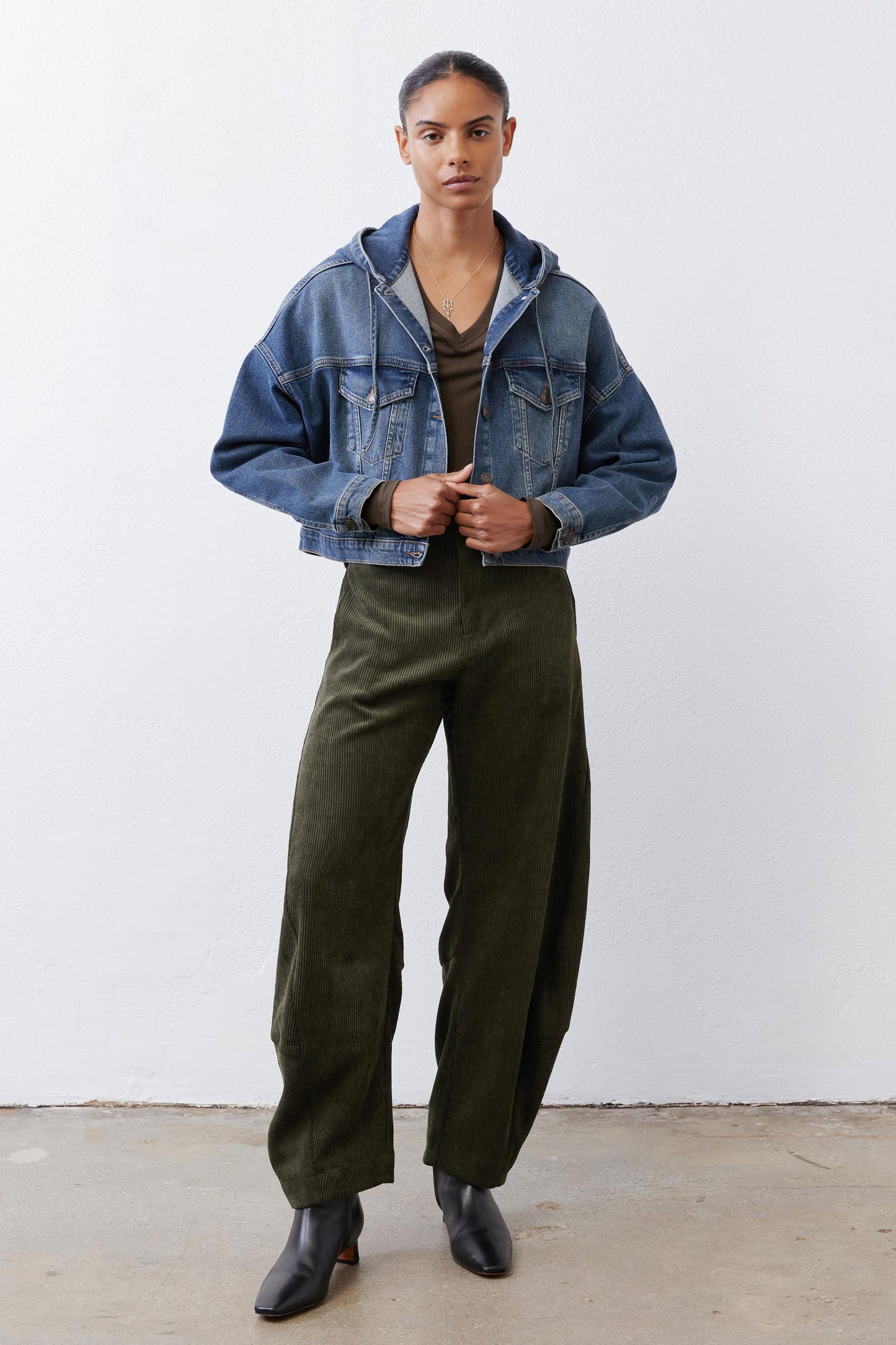 Loose dark green corduroy barrel pants, full-length with roomy straight/wide legs