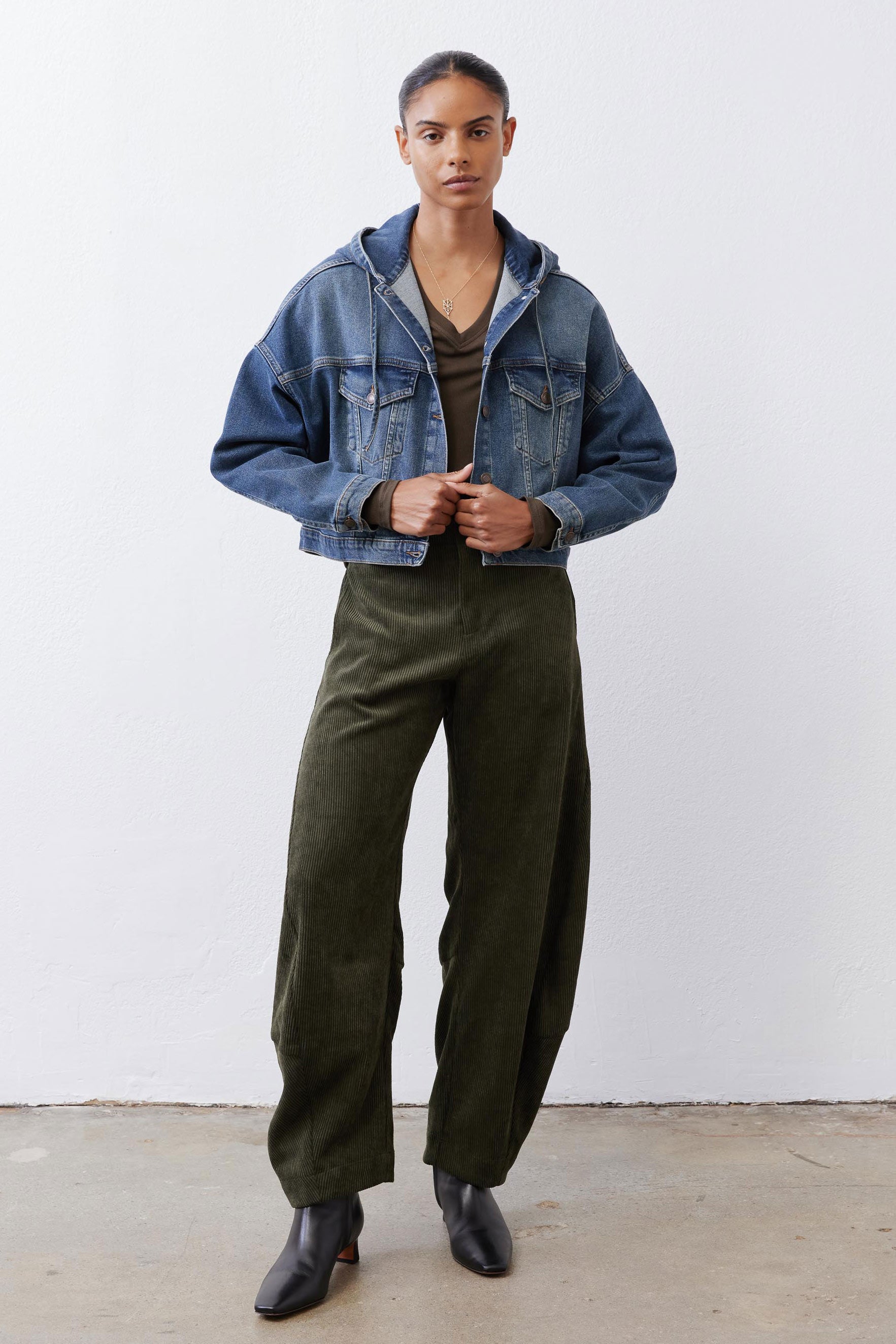 Loose dark green corduroy barrel pants, full-length with roomy straight/wide legs