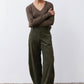 Loose corduroy barrel pants in dark green, relaxed fit through the legs
