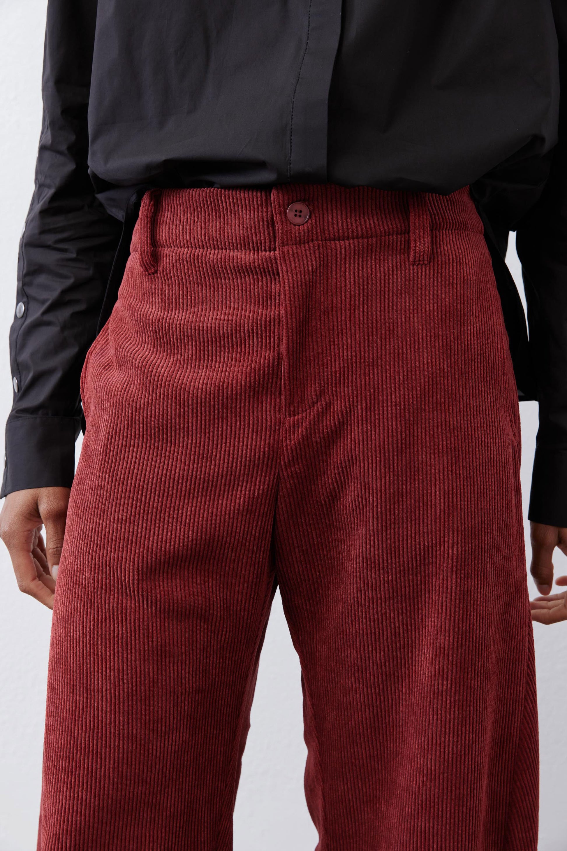 Pomegranate corduroy barrel pants close-up of waistband and buttoned front