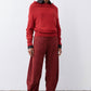 Loose barrel corduroy pants in pomegranate red with relaxed waist and wide cuffs
