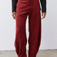 Pomegranate corduroy barrel pants front view with belt loops and pleated details