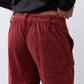 Pomegranate corduroy pants close-up of ruched waistband and vertical cord texture