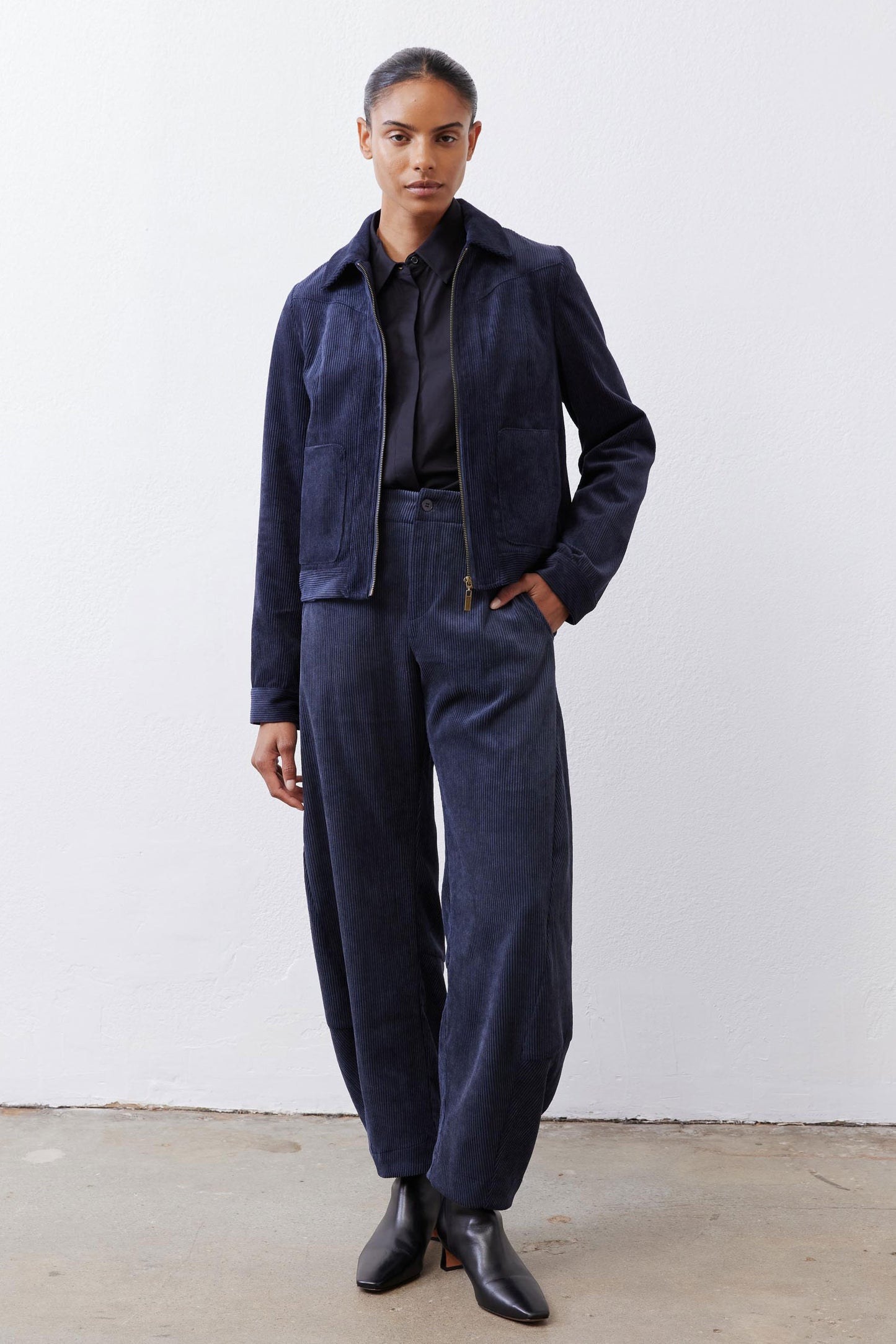 Dark navy corduroy barrel pants with loose fit and elastic waist