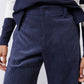Dark navy corduroy pants with elastic waist, center front seam, and button