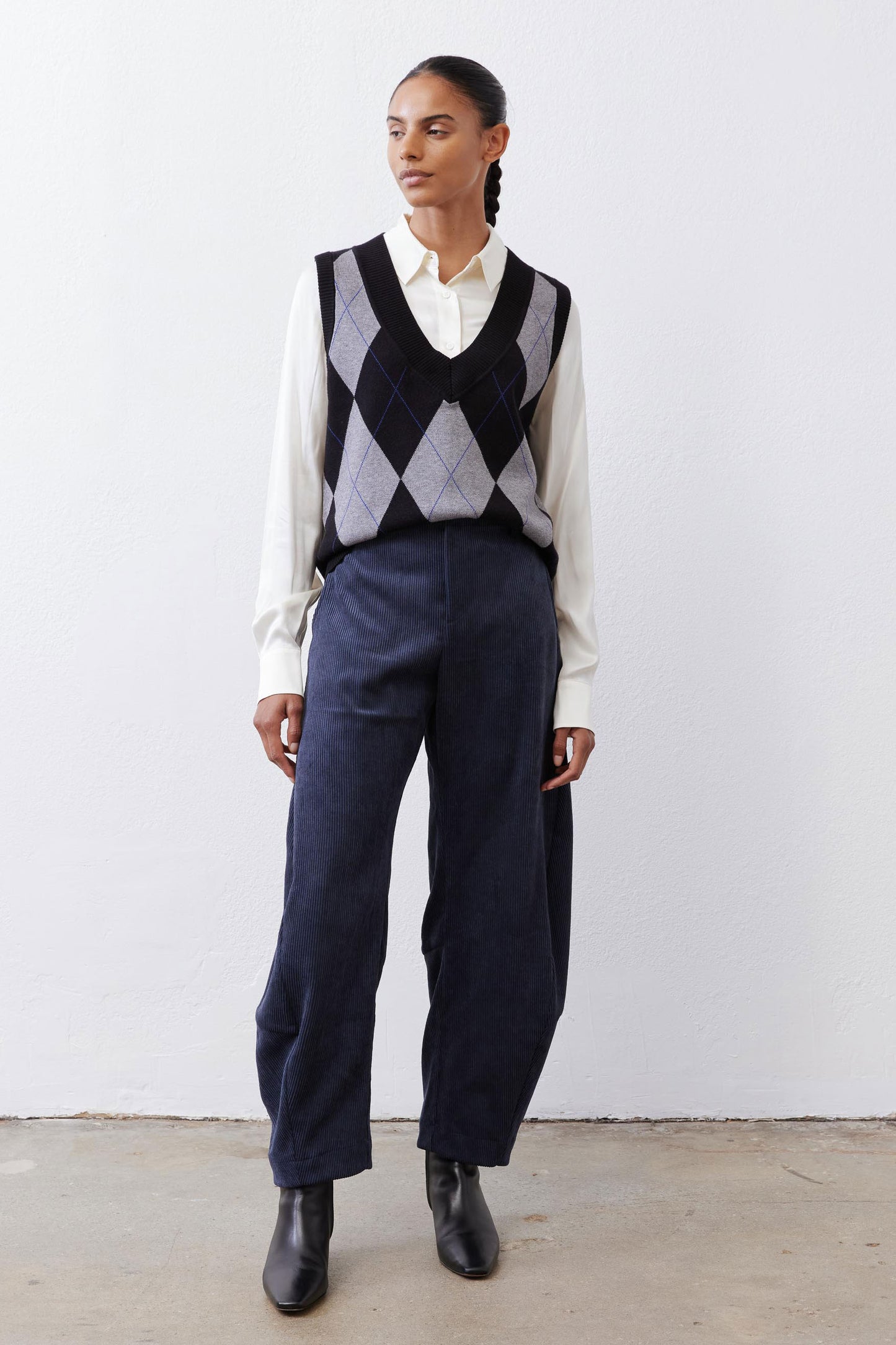 Dark navy corduroy barrel pants with loose fit and elastic waistband