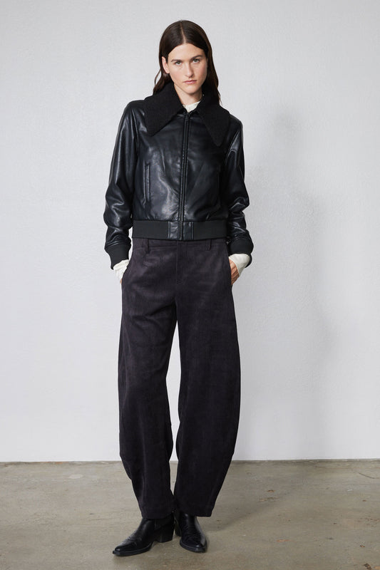 Black corduroy barrel pants with elastic waist and straight roomy legs