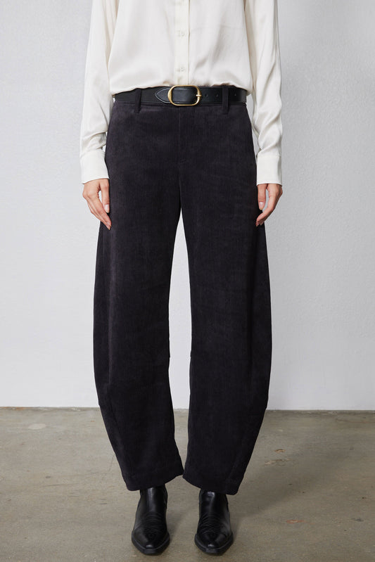 Black corduroy pants with belt loops, button fly, and wide leg opening