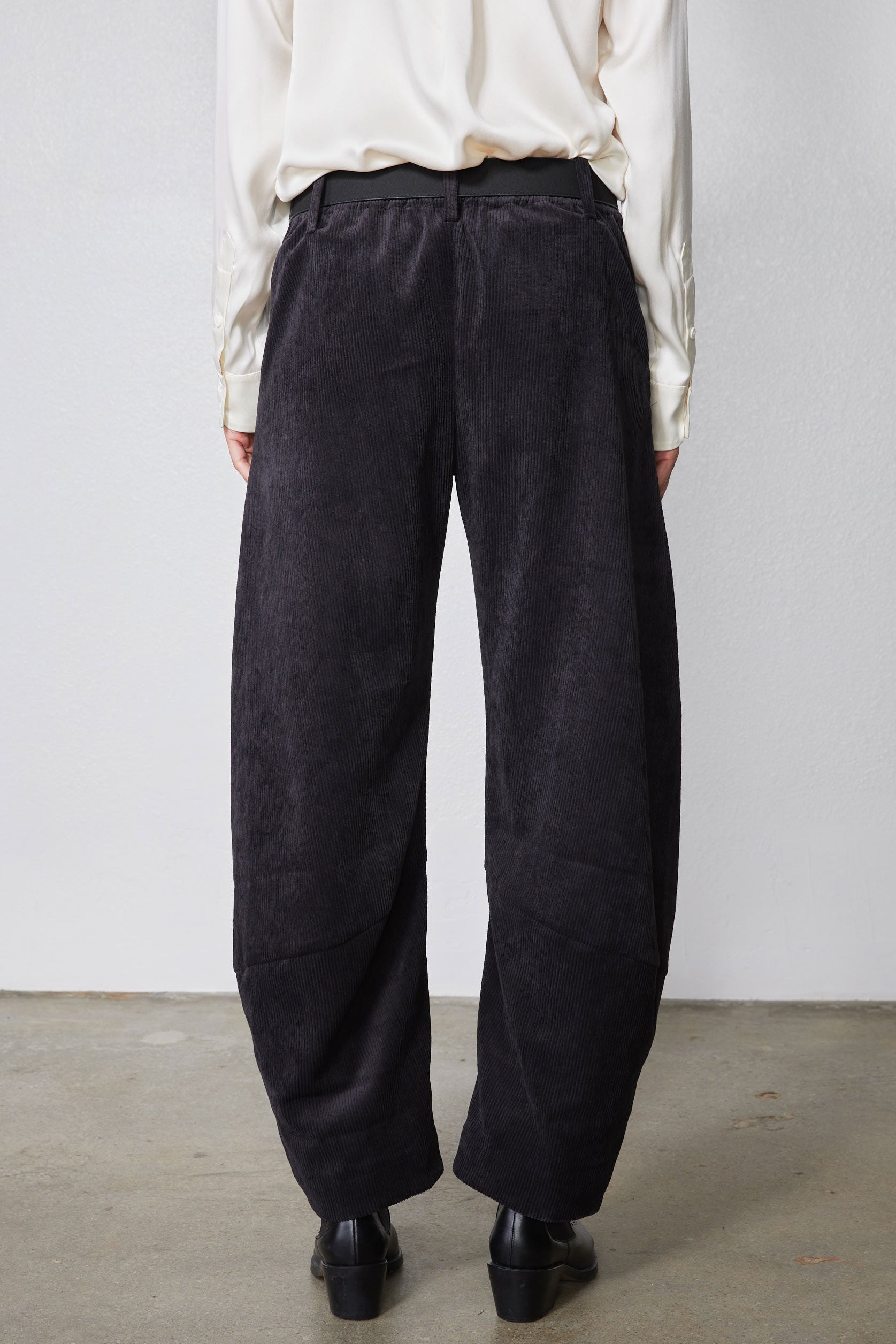 Black corduroy pants with relaxed wide barrel legs and back view