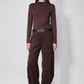 Chocolate-plum corduroy barrel pants on model, high waist with belt loops and straight legs