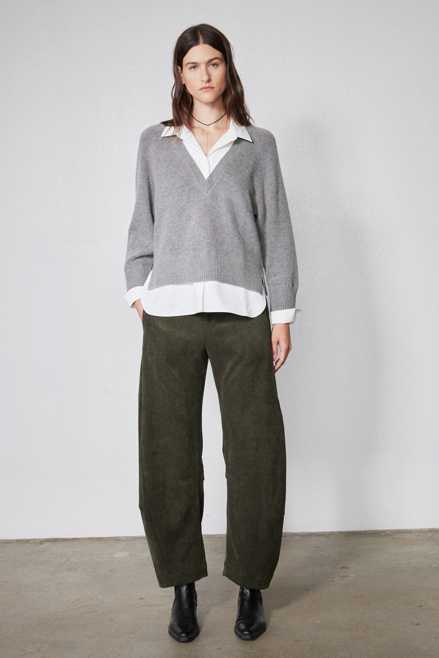 Loose barrel corduroy pants in dark olive green with relaxed fit and straight legs