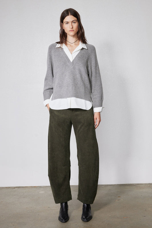 Loose barrel corduroy pants in dark olive green with relaxed fit and straight legs