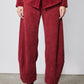 Pomegranate red loose barrel corduroy pants with wide cuffs and side pockets