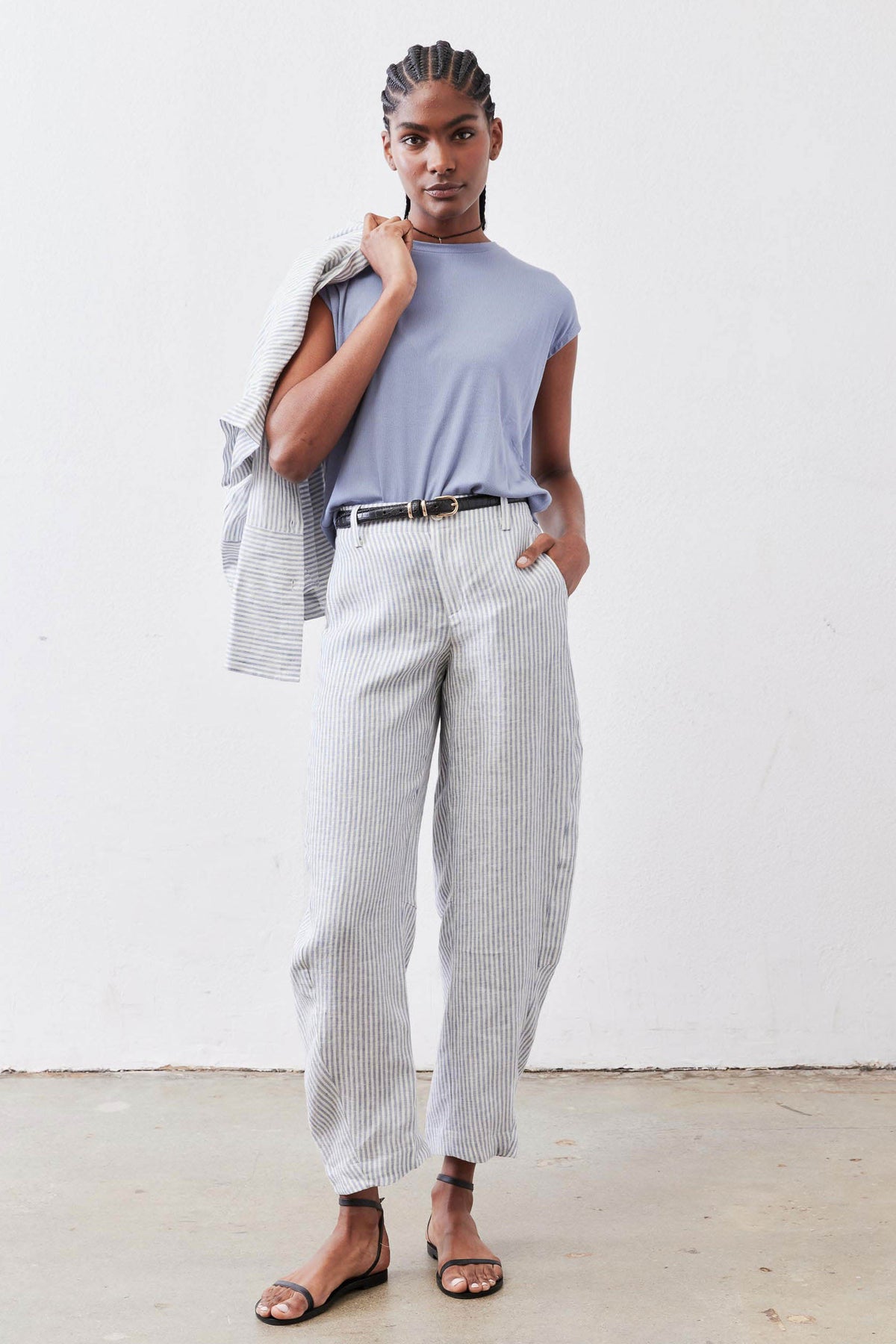 Loose linen pants with thin vertical stripes, high-rise waist and ankle-length hems