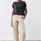 Loose linen pants in light beige, elastic waistband with drawstring, tapered ankle cuffs