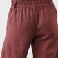 Spice brown linen pants close-up of elastic waist and front button placket