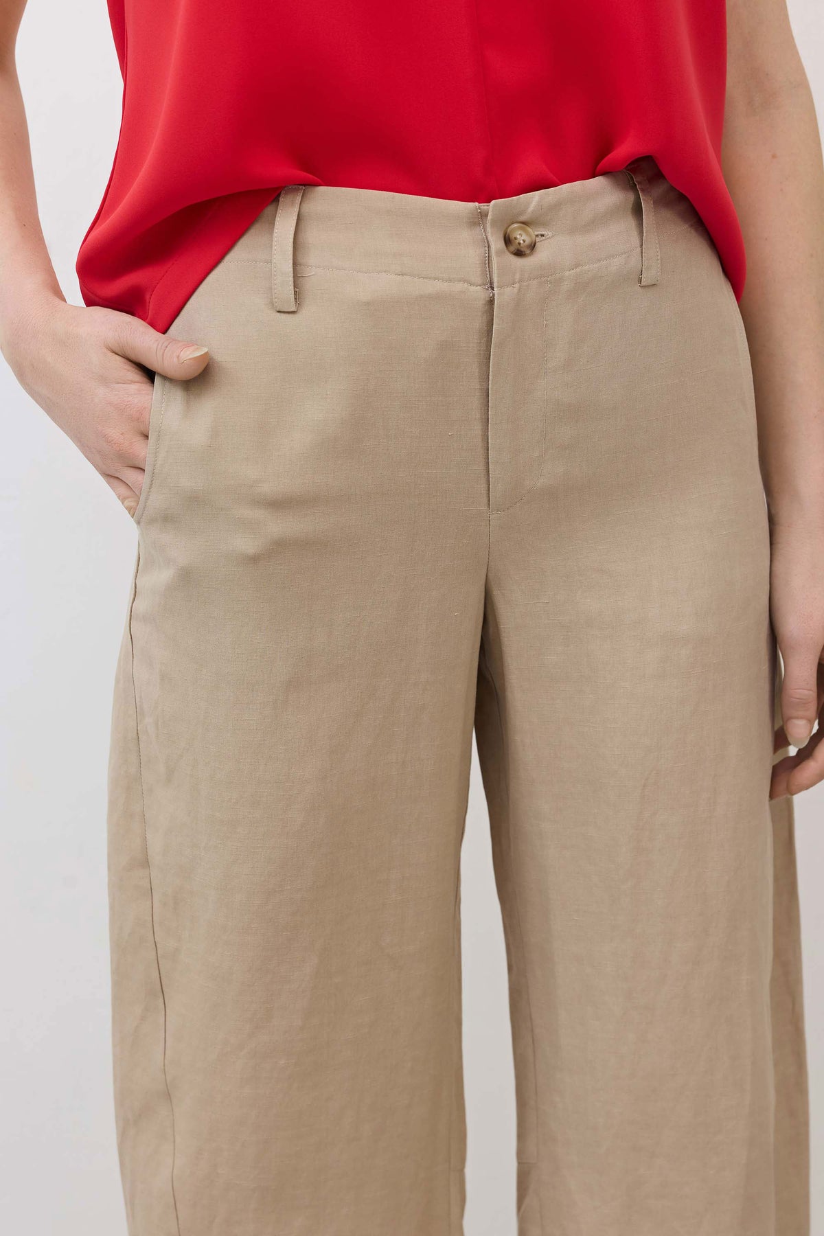 Feather gray loose silk linen pants close-up, button closure and front pockets
