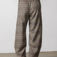 Brown plaid loose pants with elastic waistband and relaxed straight-to-wide leg