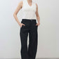 Black linen pants with wide leg drape, high waist with button closure, ankle length