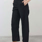 Black loose linen pants with relaxed fit, front pleats, full-length