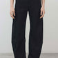 Black linen trousers with wide leg silhouette, button front, and ankle-length hem