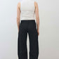 Black linen pants from back view with elastic waistband and relaxed tapered leg shape