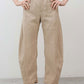 Light beige linen pants with buttoned front and elastic waist, wide relaxed legs
