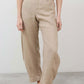 Light beige linen pants with buttoned fly, elastic waist, relaxed tapered legs