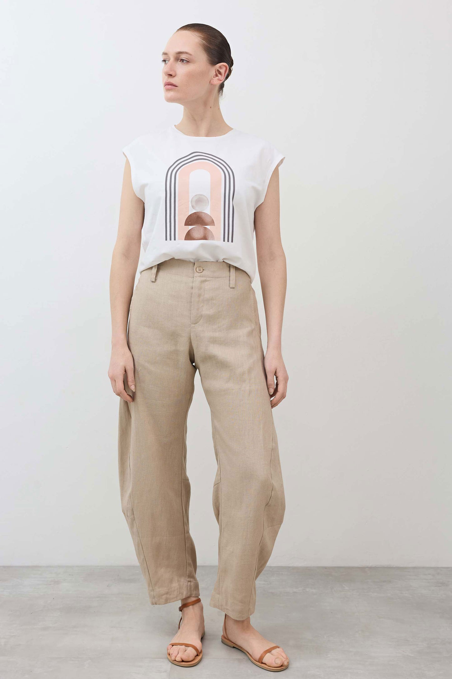 Loose linen pants in light beige, relaxed straight legs, elastic waistband