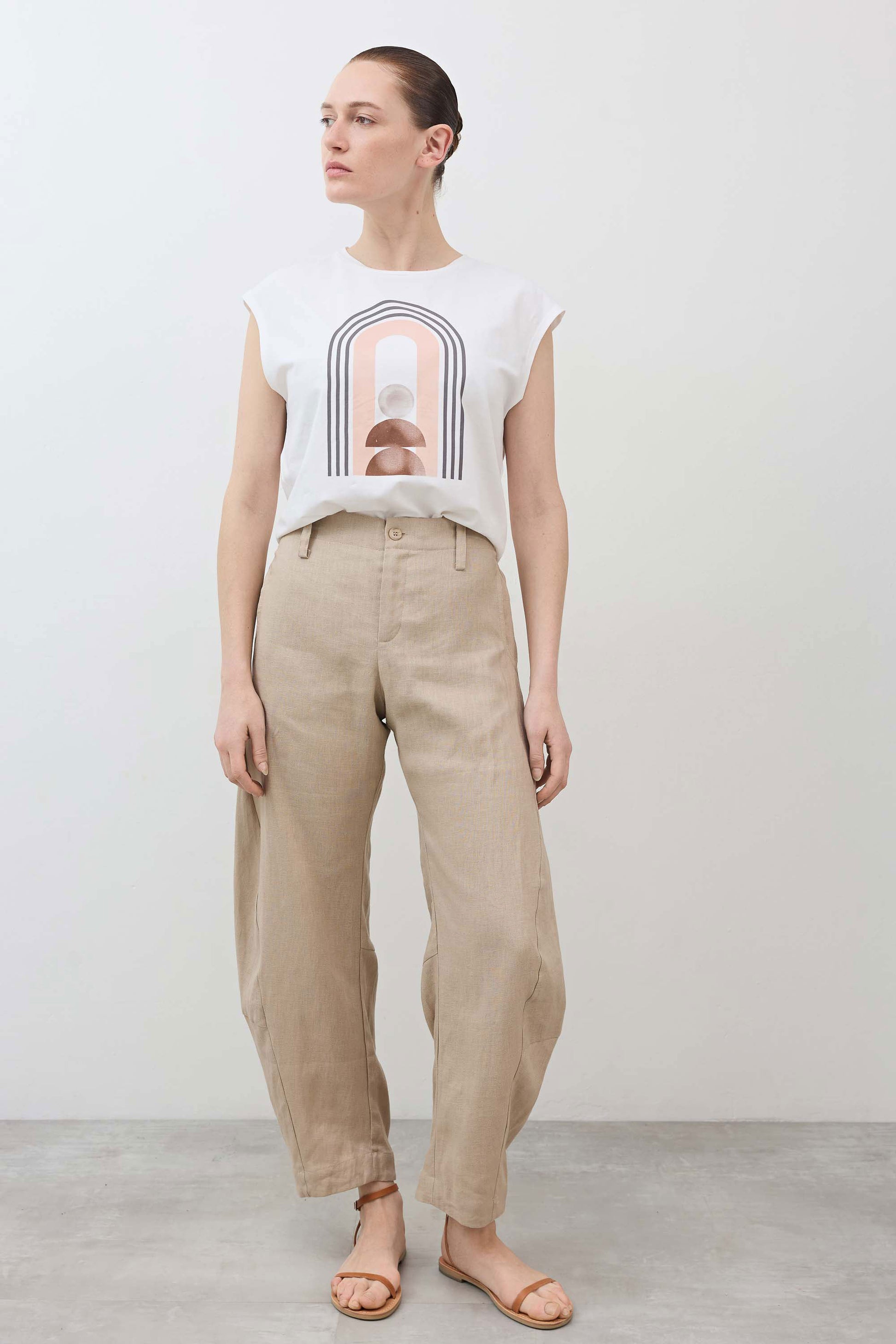 Loose linen pants in light beige, relaxed straight legs, elastic waistband