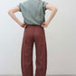 Spice brown loose linen pants back view with elastic waistband and relaxed leg