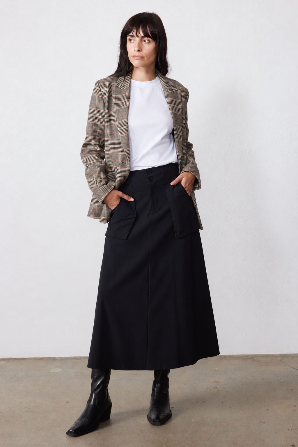 Black utility midi skirt with flap front pockets and belt loops