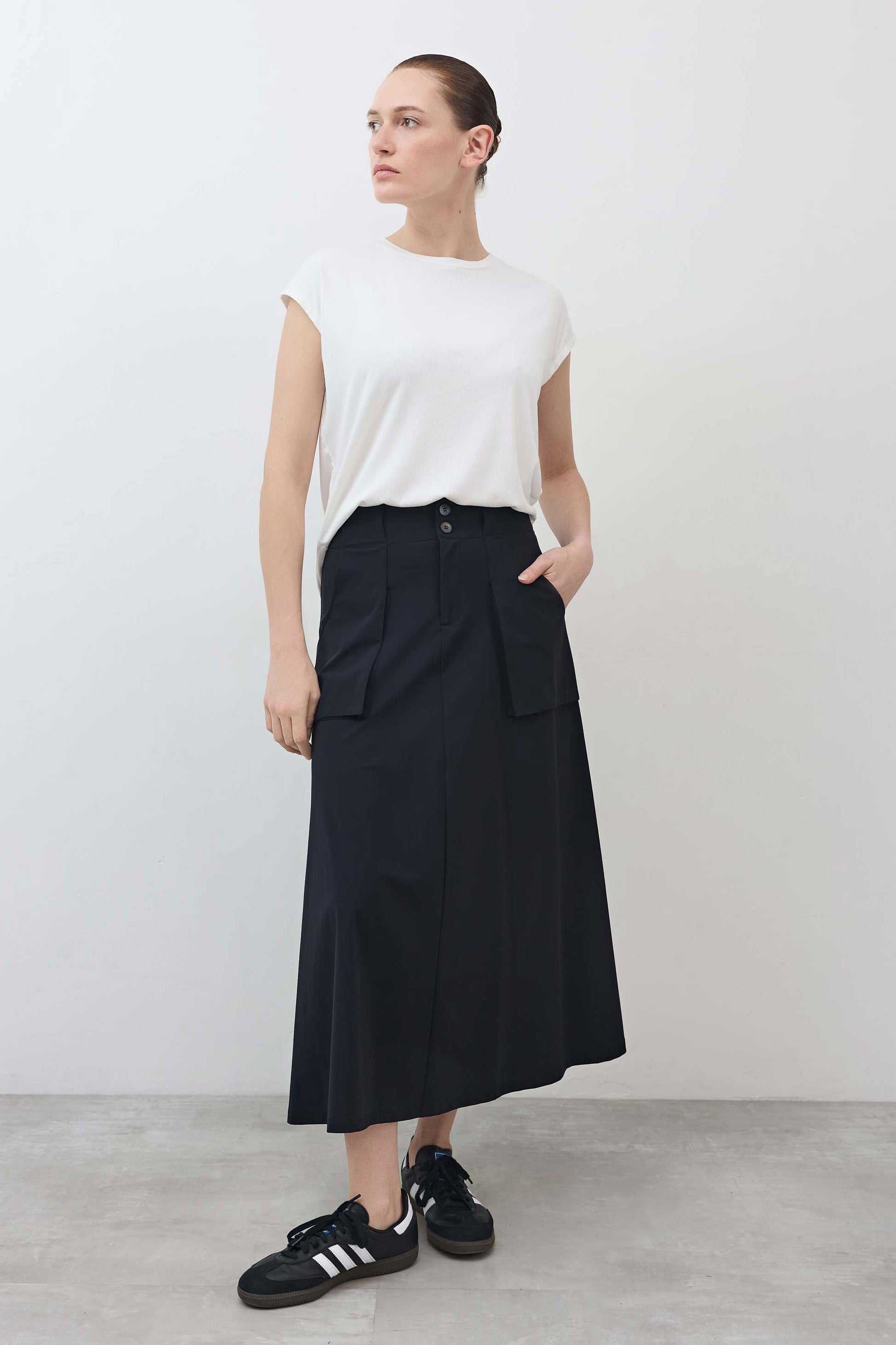 Black utility midi skirt with cargo pockets and button waistband