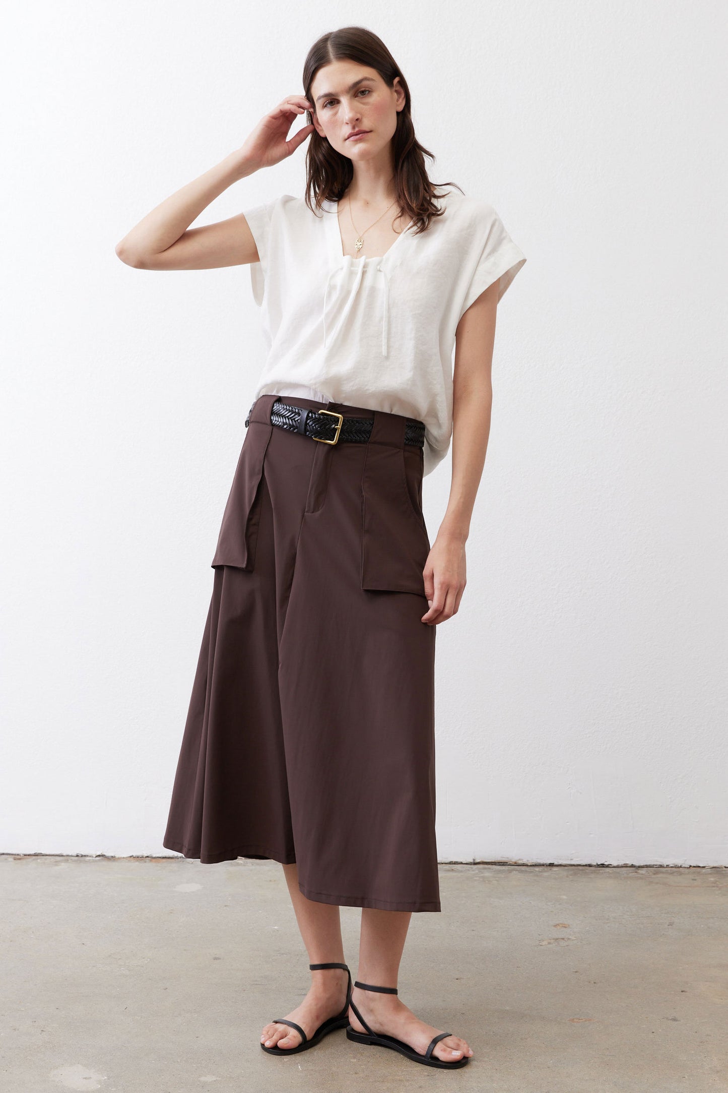 White poplin top with cinched neckline, short sleeves, and relaxed straight fit