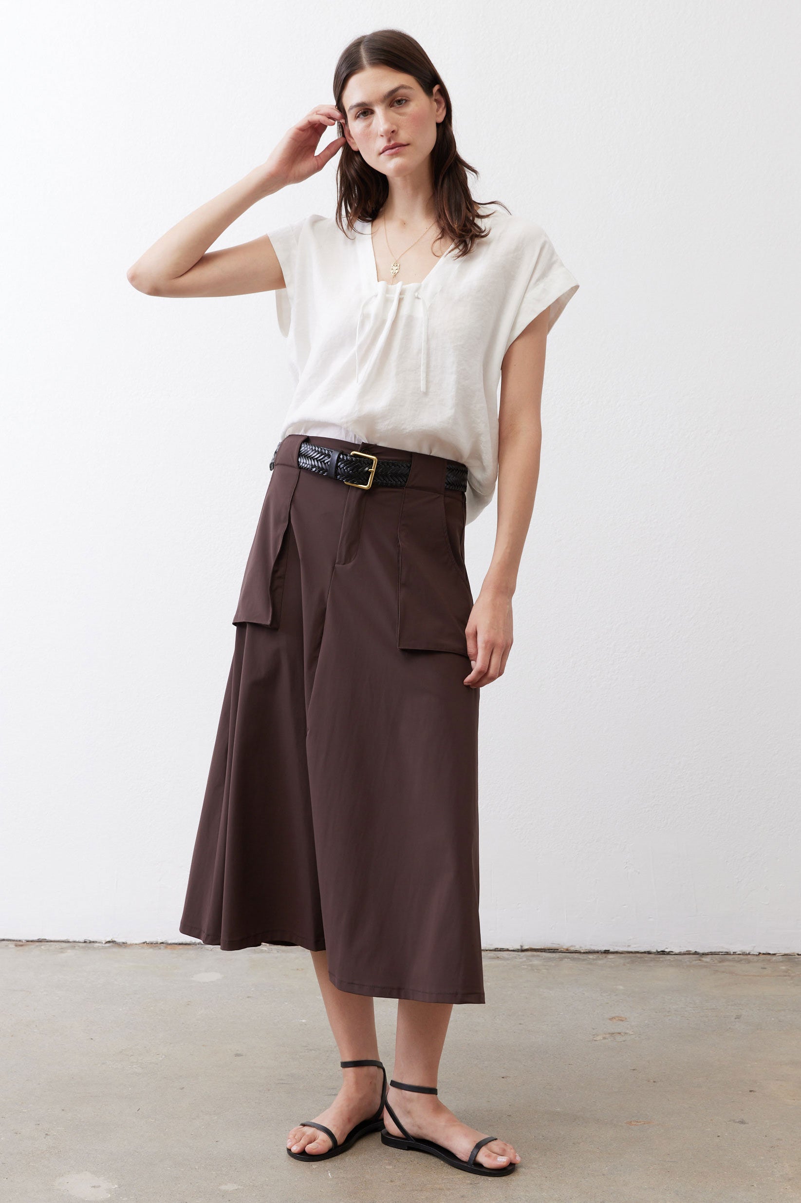 White poplin top with cinched neckline, short sleeves, and relaxed straight fit