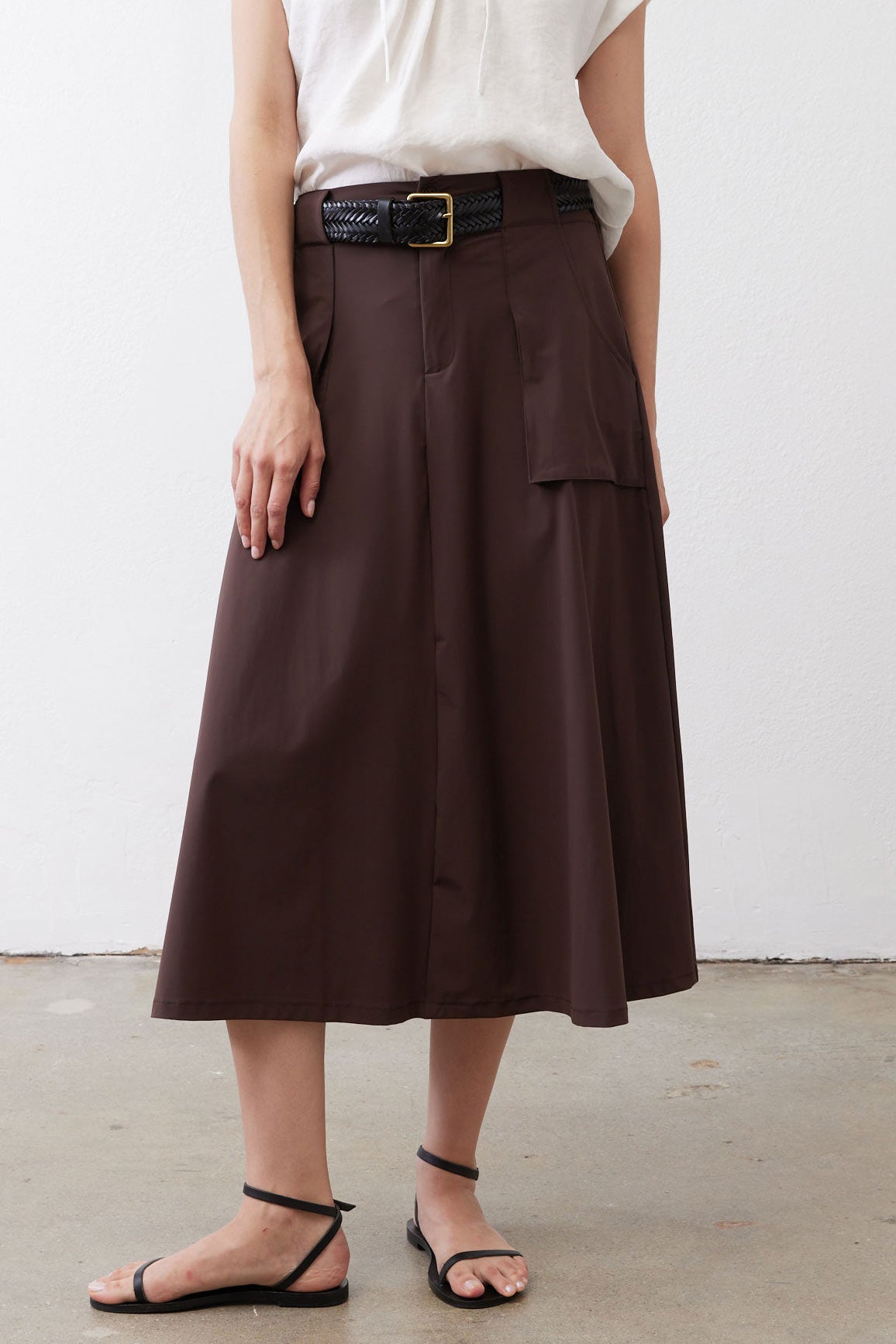 Coffee-brown utility skirt with front patch pocket and belt loops
