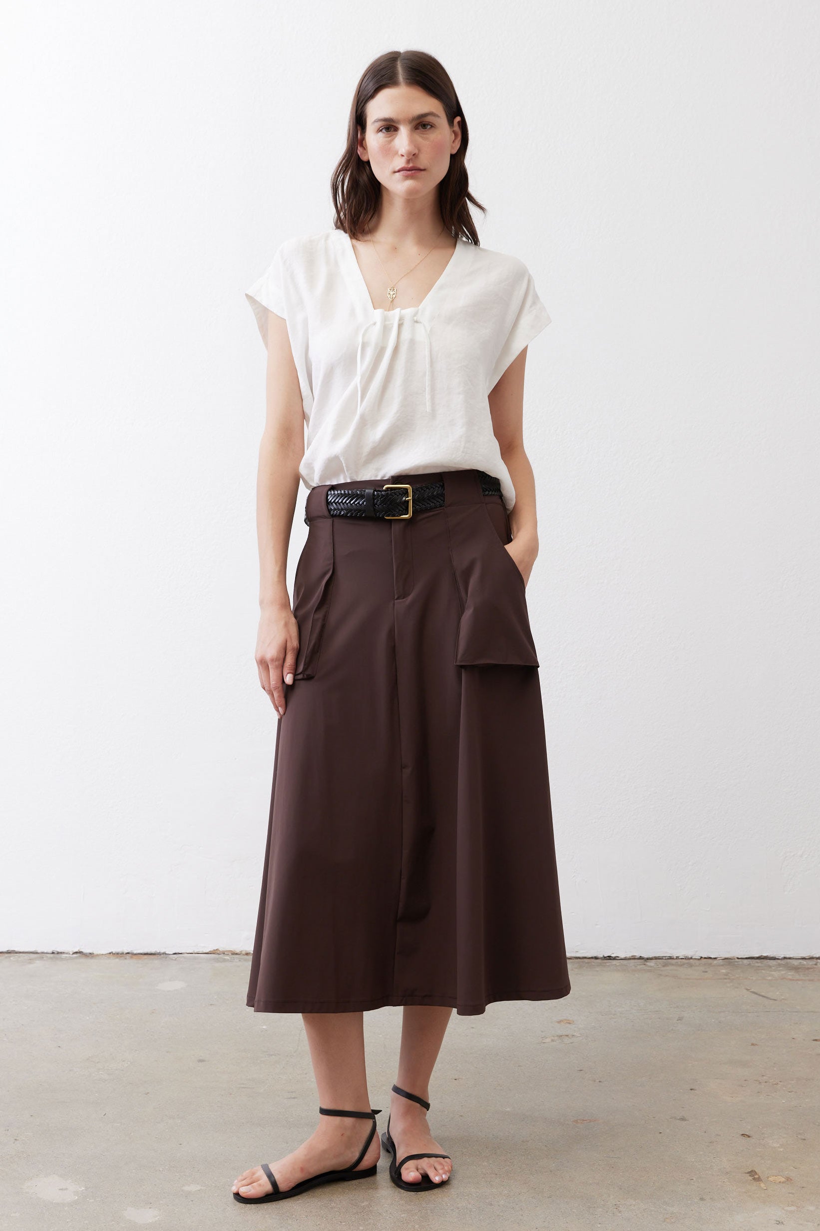 White poplin cinched-neck top with short puff sleeves and drawstring detail