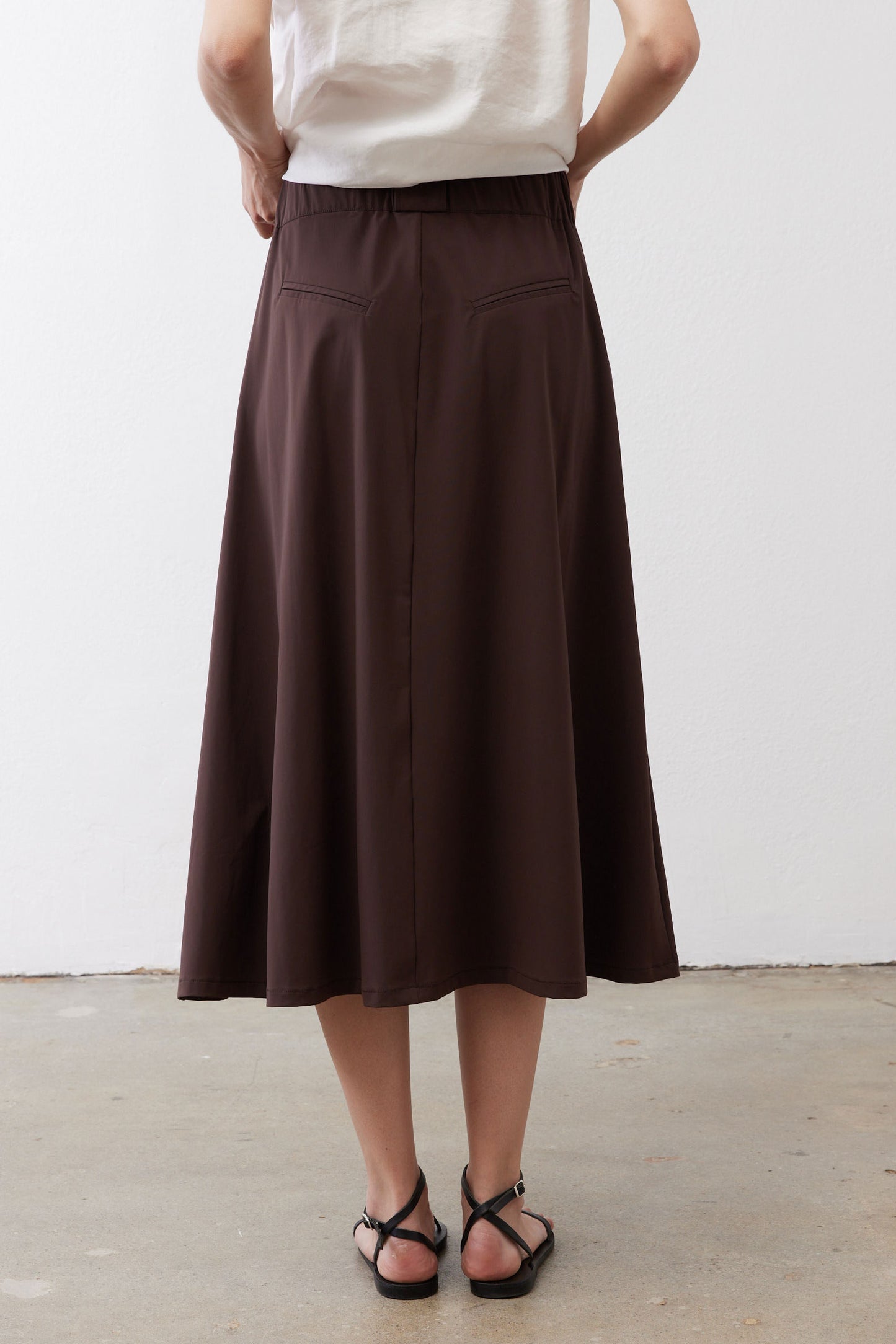 Coffee-brown utility skirt with pleated front, wide skirt silhouette