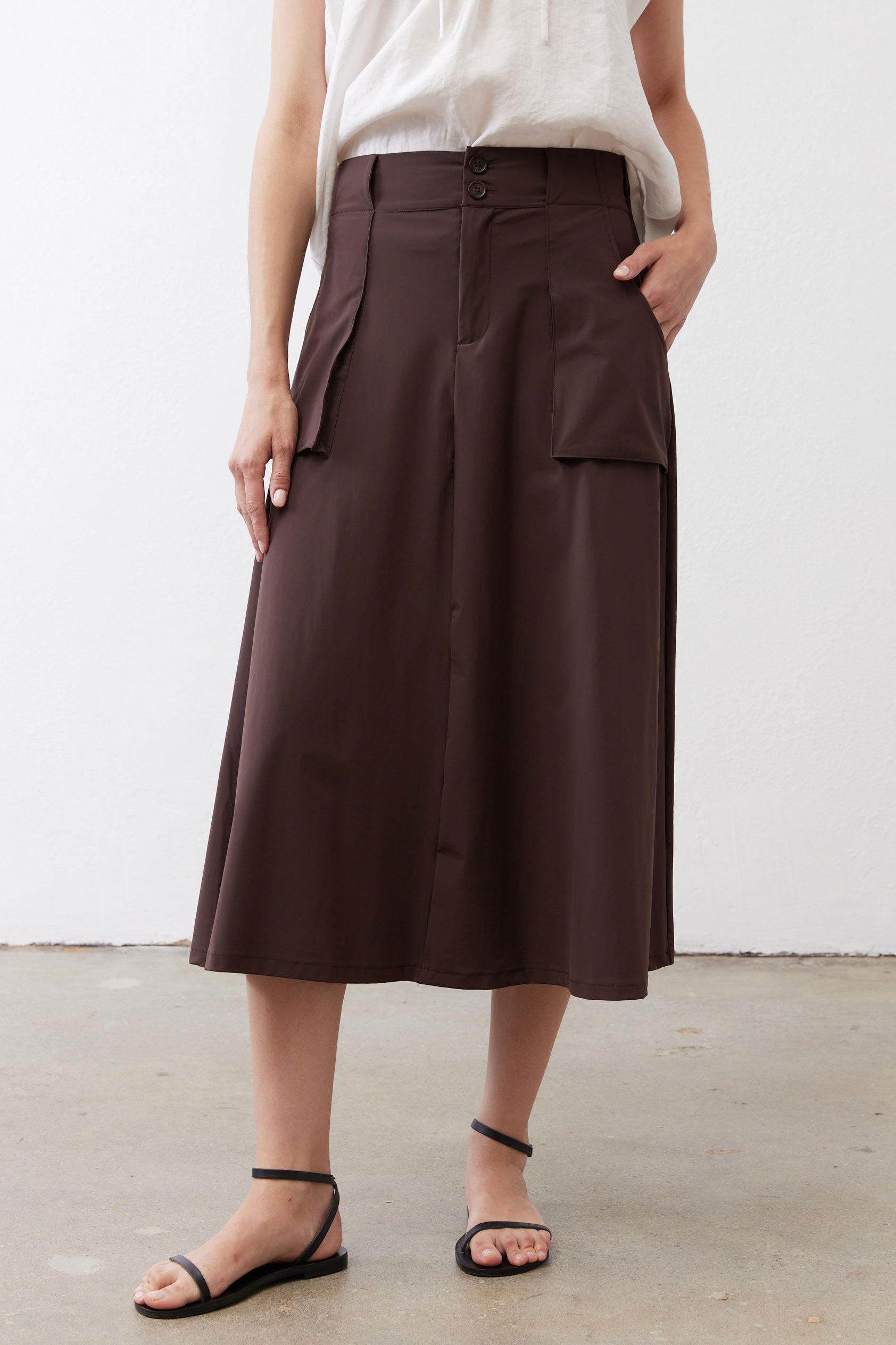 Coffee-brown utility skirt with button waistband and side pocket detail