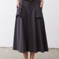 Graphite utility skirt full front, button closure, belt loops, layered cargo pockets.