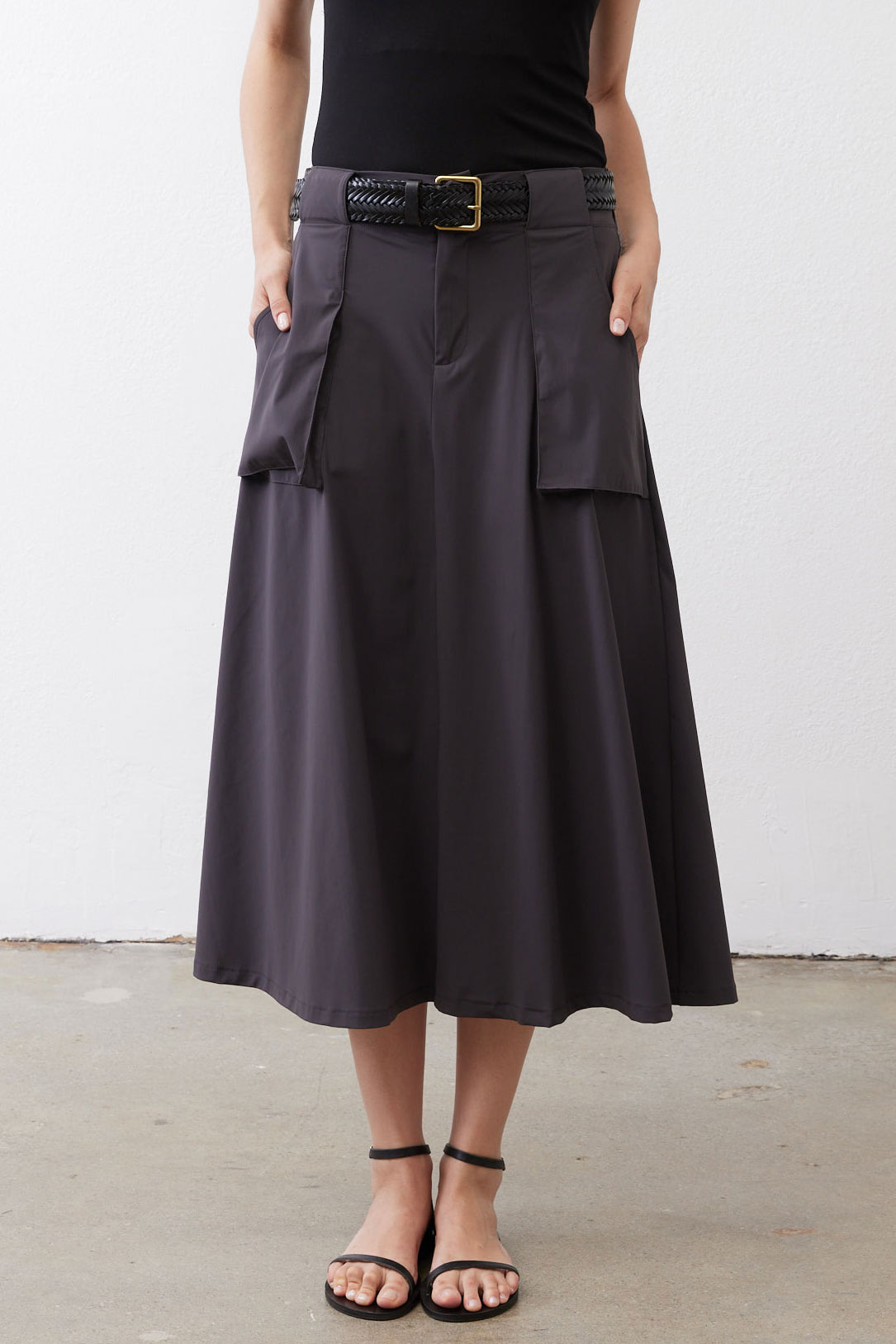 Graphite utility skirt full front, button closure, belt loops, layered cargo pockets.