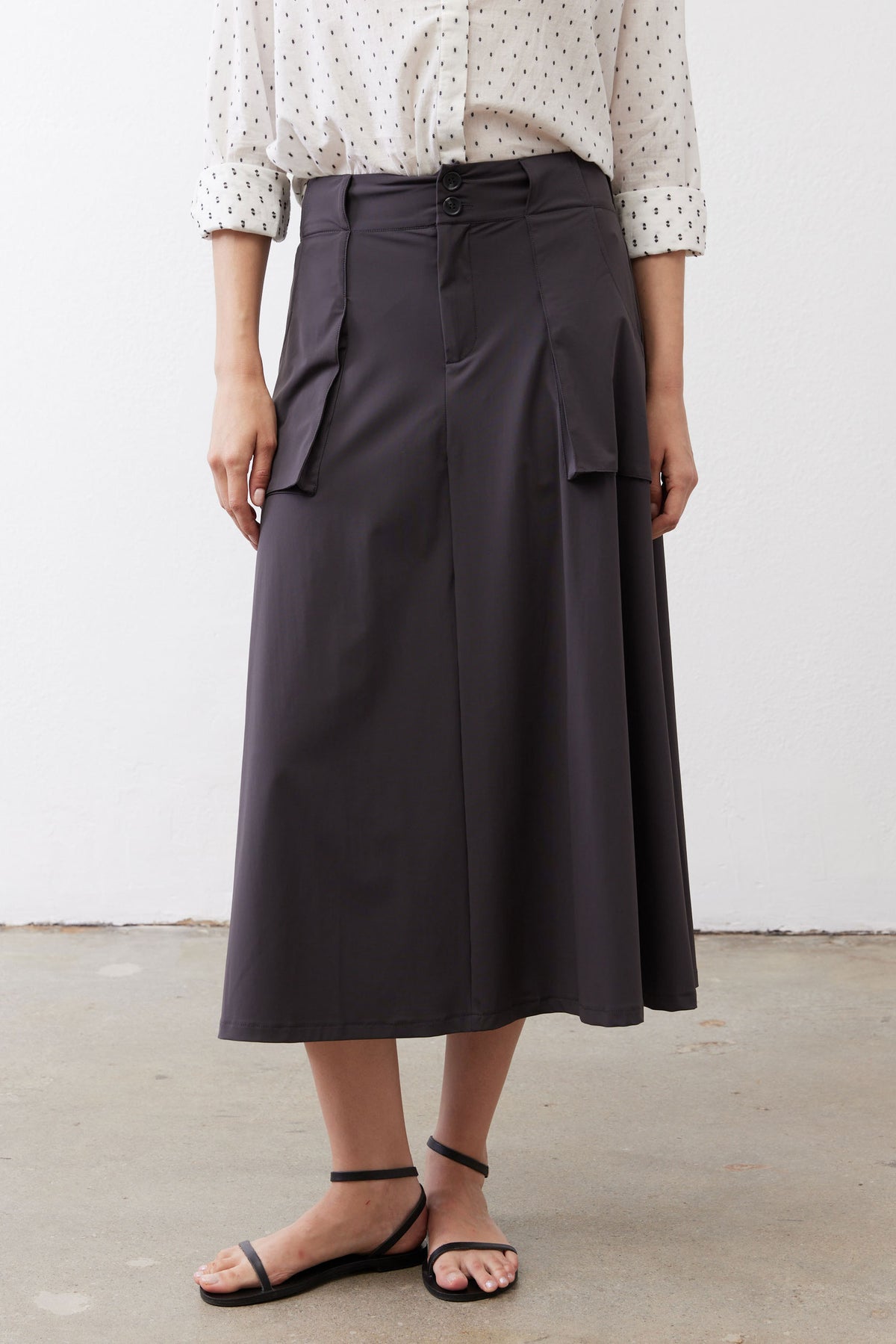 Graphite utility skirt with front button closure and side cargo pockets