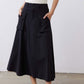 Black utility midi skirt with front buttons and two cargo pockets, A-line silhouette