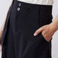 Black utility skirt close-up of button waistband and flap cargo pocket
