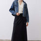 Black utility midi skirt with cargo pockets and buttoned waistband, front angle